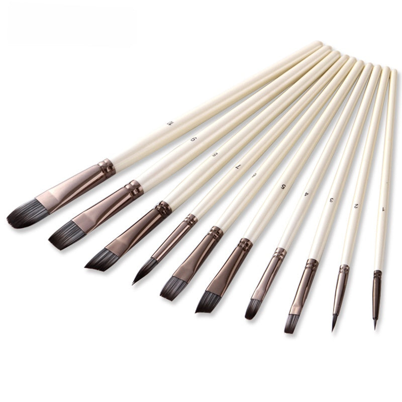 Set of paintbrushes with wooden handles on a white background