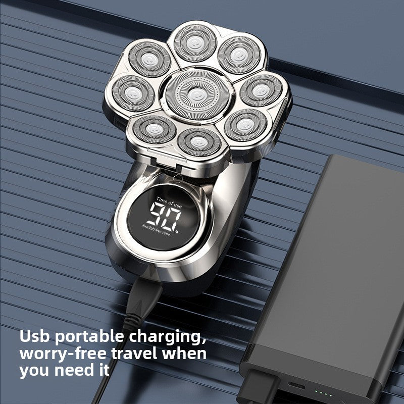 Silver electric shaver with digital display on a blue background